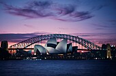 Australia, Sydney, View of Sydney Opera House and Harbor Bridge from Royal Botanic Gardens