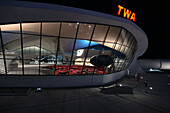 Night exterior of the TWA hotel designed by Eero Saarinen at JFK Airport