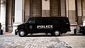 A NYPD van parked near New York City Hall and the Tweed Courthouse and Comptroller in Manhattan.