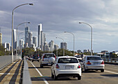 Traffic heading over bridge into Surfers Paradise City on a cloudy day