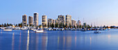 Panorama looking from Marina Mirage past moored boats to high rise aparment blocks in the background in the early evening