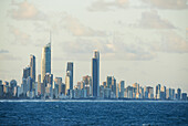 Looking across choppy water at skyline of Surfers Paradise City