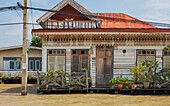 Old houses on the Chao Phraya River in Bangkok