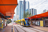 Tram pulling up to station on the Gold Coast