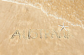 The word Australia written in the sand