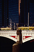 Train crossing old bridge in Melbourne city