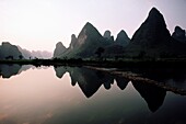 Reflections of mountains in the water, Yangshuo, Guangxi Province, China