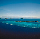 Aerial of a group of small pacific islands
