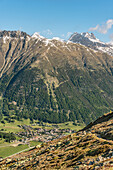 View from Muottas Muragl to the mountain village of Samedan in the Engadin, Graubünden, Switzerland