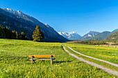 Path in the Loisach Valley with a view of the Wetterstein Mountains with the Zugspitze (2,962 m) near Eschenlohe, Bavaria, Germany
