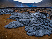 Pahoehoe lava spreads across the landscape around Fagradalsfjall volcano, Volcanic eruption at Geldingadalir, Iceland