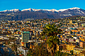 Cityscape with Snow-capped Mountain in a Sunny Day in Lugano, Ticino in Switzerland.