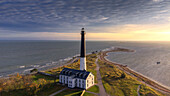 Sorve Tuletorn Lighthouse, Saare, Saaremaa, Estonia, Blatikum, Baltic Sea. Aerial view, sunset