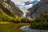 View of Glacial River and Geltscher Briksdalsbreen, Sunny. Briksdalsbre, Vestland, Norway.
