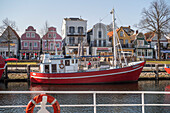 Fishing boats at the middle pier in Warnemünde in the morning.