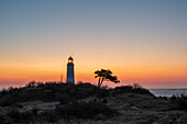 Sunrise at the Dornbusch lighthouse on the Schluckwieksberg, Hiddensee Island, Mecklenburg-West Pomerania, Germany