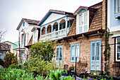 Exterior of traditional wooden houses in rainy day in Tbilisi, capital city of Georgia