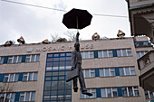 Hanging Umbrella Man, sculpture by Michal Trpák, Mosaic House, Prague, Czech Republic