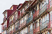 Colorful house facades with balconies in Porto, Portugal