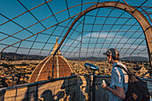 Man with backpack in foreground, view from Duomo's Campanile bell tower to dome, Duomo Santa Maria del Fiore, Duomo, Cathedral, Florence, Tuscany, Italy, Europe