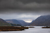 View of Lake Lough Beagh. Mountains and low clouds in the background. Derrylahan, Cross Roads, County Donegal, Ireland.