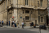 Musee Carnavalet in Rue des Francs Bourgeois streetscene with people, The Marais, Paris, France