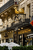 L'Escargot Montorgueil Restaurant exterior with golden snails on sign Rue Montor