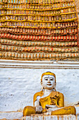 Buddhas statues and carving in a cave temple, Myanmar, Asia