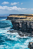 Rocky cliff at South Point, wind farm on the cliff top, Big Island,USA