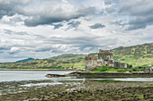Eilan Donan, a remote castle on a tidal island with low tide, UK