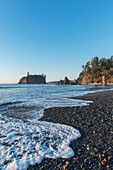 Waves breaking on the pebbles of Ruby Beach at dawn, USA