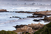 View over a sandy beach and rock formations on the Atlantic coastline, South Africa