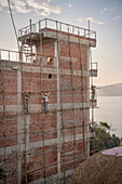 daredevil construction workers at Lake Begnas Tal, Lekhnath near Pokhara, Nepal, Himalayas, Asia