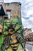 LX Factory in Lisbon. Historical industrial complex with numerous art and design shops as well as unique restaurants. | Ornamental bee artwork in the FX Factory complex