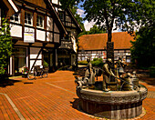 Bonifatius fountain and half-timbered houses on Karl-Bolke-Platz in Bad Sassendorf, Soest district, North Rhine-Westphalia, Germany
