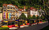 Train station &quot;Bad Wildbad Kurpark&quot; with the S-Bahn and the town hall, Bad Wildbad, Baden-Württemberg, Germany