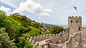 The walls and towers of the Castelo dos Mouros castle complex above the town of Sintra in Portugal