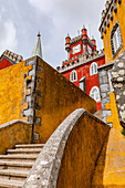 A winding staircase inside the Palacio Nacional da Pena, built with different architectural styles, above Sintra, Portugal