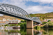 Steel bridge over the Douro river in the Alto Douro wine region near Pinhao in Portugal