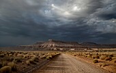 Stormy skies pass through the Southern Utah landscape at sunset.