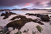 Luskentyre Beach on the Isle of Harris,captured at sunset in early November using a long shutter speed to blur the movement in the clouds.