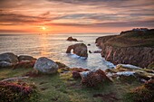 The setting sun captured from Pordenack Point,near Land's End in Cornwall on an evening in late.