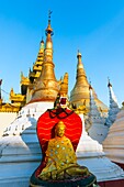 Myanmar (formerly Burma). Yangon. (Rangoon). The Shwedagon Pagoda Buddhist holy place is the first religious center of Burma because according to the legend,it contains relics of four ancient Buddhas,including eight hair of the Gautama Buddha. Buddha statue.
