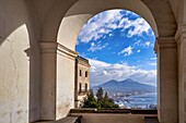 Naples Campania Italy. View of the gulf of Naples and Mount Vesuvius from the Certosa di San Martino (Charterhouse of St. Martin),a former monastery complex,now a museum,in Naples,southern Italy. It is the most visible landmark of the city,perched atop the VomeroA hill that commands the gulf. Carthusian monastery,it was finished and inaugurated under the rule of Queen Joan I in 1368. It was dedicated to St. Martin of Tours.