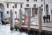 Venice,Veneto,Italy: Gondoliers at Rialto at Grand Canal.
