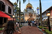 Singapore,Singapore - October 19,2018: Young woman taking pictures in front of the Masjid Sultan (Sultan Mosque) in Muscat Street - Kampong Glam. Muslim quarter,Arab quarter,is a popular tourist destination in Asia.