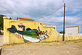 Neo Karlovassi, Streetart-Graffiti Riding Enlightenment des Athener Künstlers Billy Gee, entstanden zum Summer Street Art Festival 2017 auf der Insel Samos in Griechenland