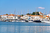 Fishing port of Pythagorion looking towards the church of Metamórphosis tou Christoú on the island of Samos in Greece