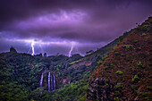 Lightning flashes behind Opekaa Falls, Kauai, Hawaii, United States of America, Pacific
