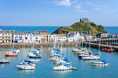 Ilfracombe harbour with yachts and St. Nicholas Chapel overlooking the town of Ilfracombe, Devon, England, United Kingdom, Europe
